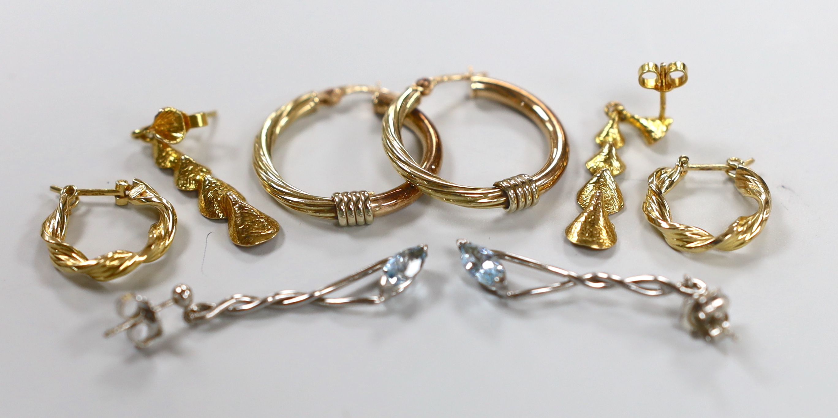 A pair of modern 9ct white gold and blue topaz? set drop earrings, 33mm and three assorted pairs of 9ct gold earrings, gross 10.6 grams.